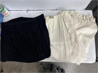 Two long skirts black and white one both have