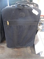 Travelers Club suitcase on wheels