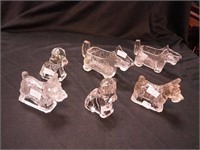 Six vintage glass candy containers of dogs,