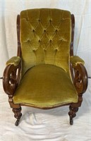 Antique, moss, green armchair, on Castor wheels,