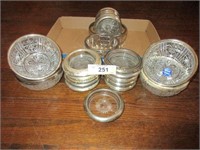 17 silver-plate rimmed coasters, 6 silver-plate