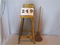 Metal chair and vintage plunger
