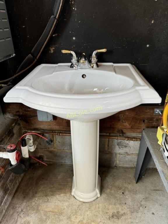White pedestal sink with base, Measures: 24"W x