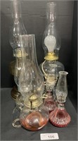 6 Varying Size Glass Oil Lamps.