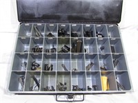 Metal parts bin full of assorted gun parts, sight