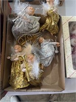 lot of angel ornaments with trumpets