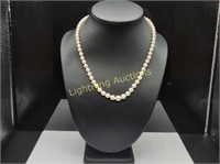 GRADUATING PEARL STRAND WITH 14K YELLOW GOLD CLASP