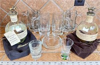 Beer mugs shot glasses and ashtray decanters with