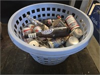 Plastic basket with collectible cans and bottles