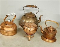assorted copper teapots