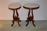 Pair of oval marble top pedestal stands