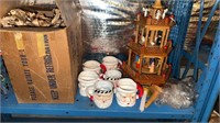 Box of vintage ceramic Santa Claus mugs, and a