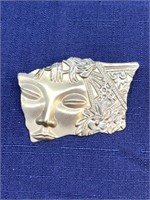 Face and flower brooch’