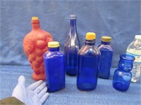 5 blue bottles & 1 grape bottle
