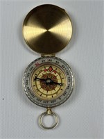 Brass toned locket  compass with glow-in-the-dark