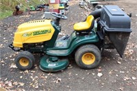 Yard man riding lawn mower