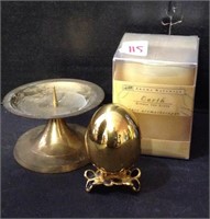 Brass colored metal decor and candle