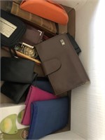 Box of wallets and eyeglasses and disposable