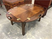 Mahogany coffee table with tray style top.