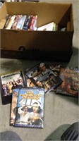 One box lot of 28 movie DVDs including season