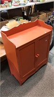 Two door storage console cabinet painted in a