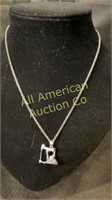 Oil well pump jack pendant on a sterling silver