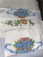 Embroidered pillowcases, napkin rings, white