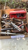 Box containing hammer, punch, rail nail, oil