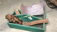 Green wood tool crate with furniture parts and