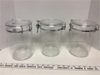 3 plastic canisters with locking lids 8 in