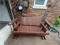 wooden glider on back patio BRING HELP TO LOAD