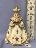A porcelain statue, 5" tall, of the Infant of Prag