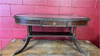 Vintage oval wood coffee table, brass feet 37 in