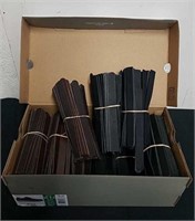 Shoebox full of leather straps