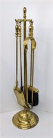 Gold Colored Fireplace Tools on Stand