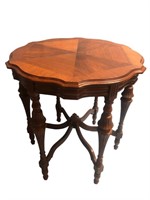 Walnut scalloped top center or radio round table