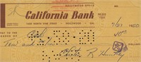 Evening news anchor Chester Huntley signed check