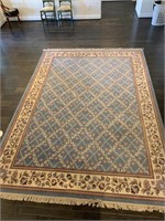 A pretty Light blue and mauve large area rug