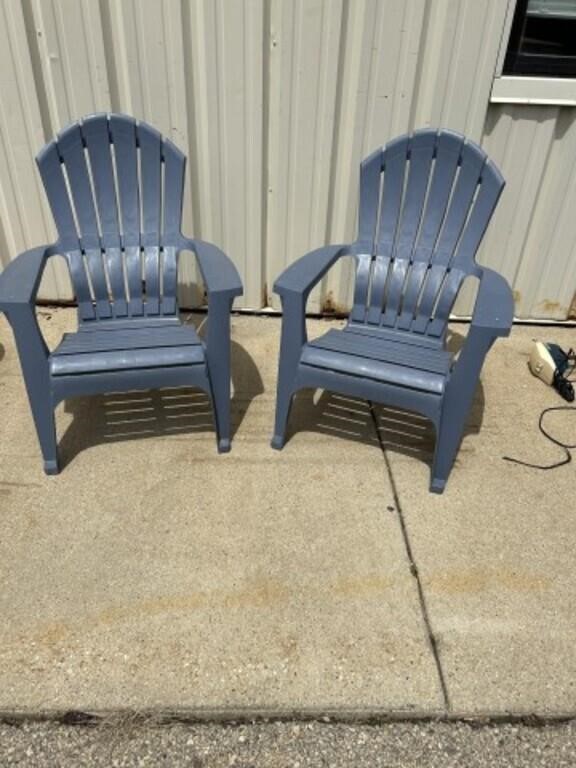 Pair of blue plastic Adirondack style chairs