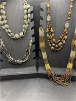 Lot of four multi strand beaded necklaces