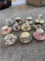 11 decorative cup and saucers