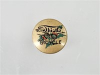 EARLY CELLULOID THISTLE BICYCLE BUTTON