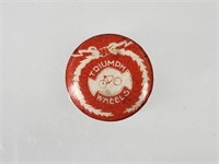 EARLY CELLULOID TRIUMPH WHEELS BICYCLE BUTTON