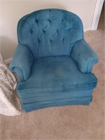 Blue swivel rocking chair.