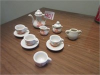 miniature tea set pieces .