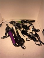 4 curling irons and one flat iron hot hair tools