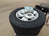 4 Tires on rims off a Chevy; size: 265/65R18; incl
