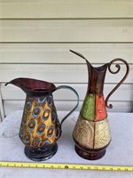 2 metal pitchers