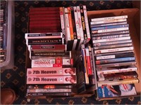 Two boxes of DVDs and 10 volumes of