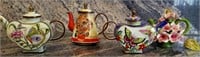 T - LOT OF 4 COLLECTIBLE TEAPOTS (P121)